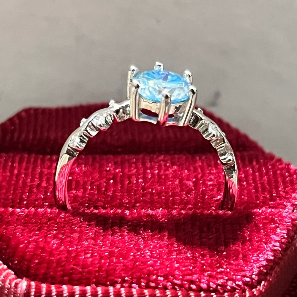 Elegant Silver Moissanite Ring with Blue Gemstone